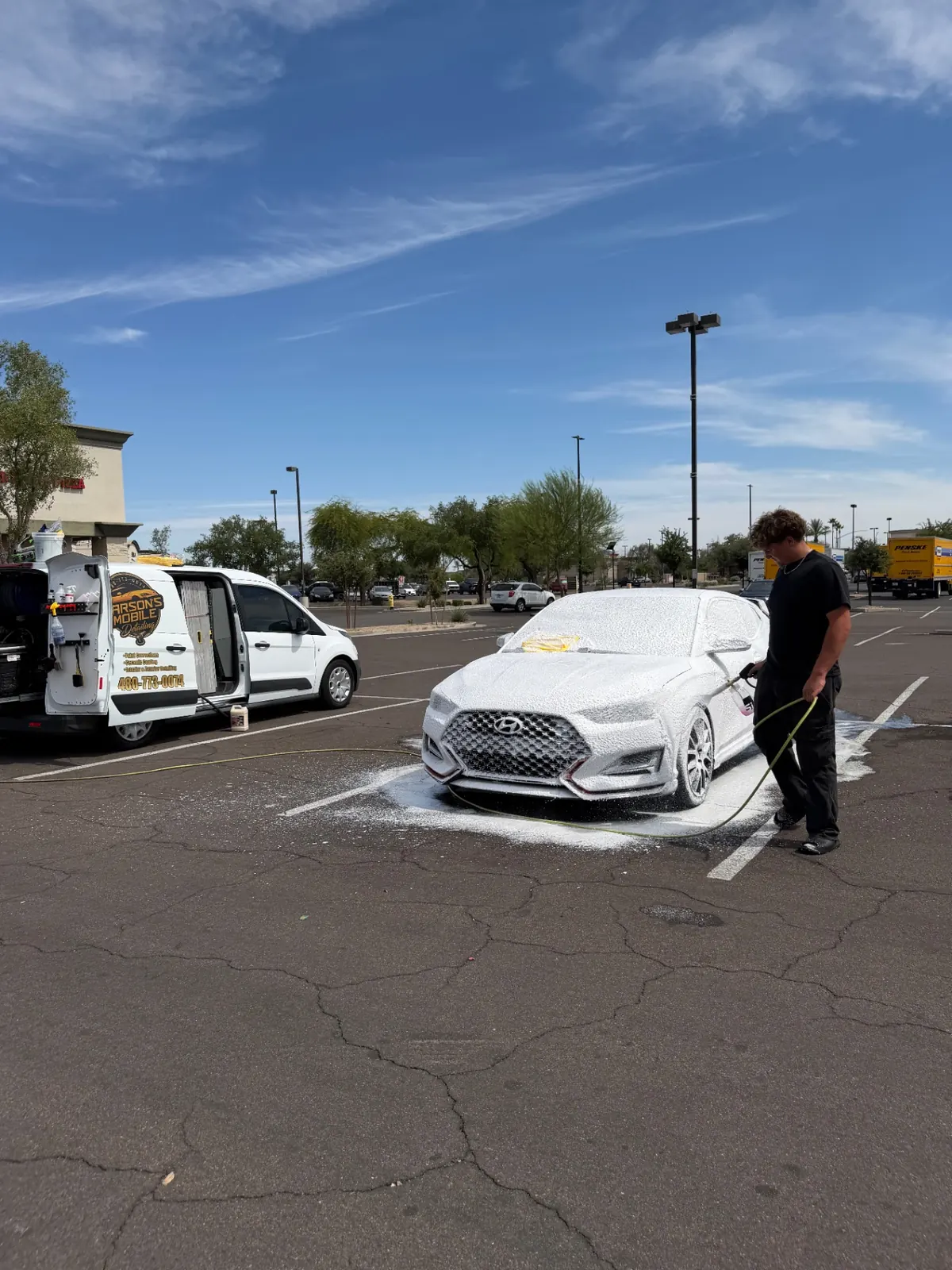 Hyundai sedan covered in thick snow foam during a Carson's Mobile Detailing exterior hand wash in Surprise, AZ